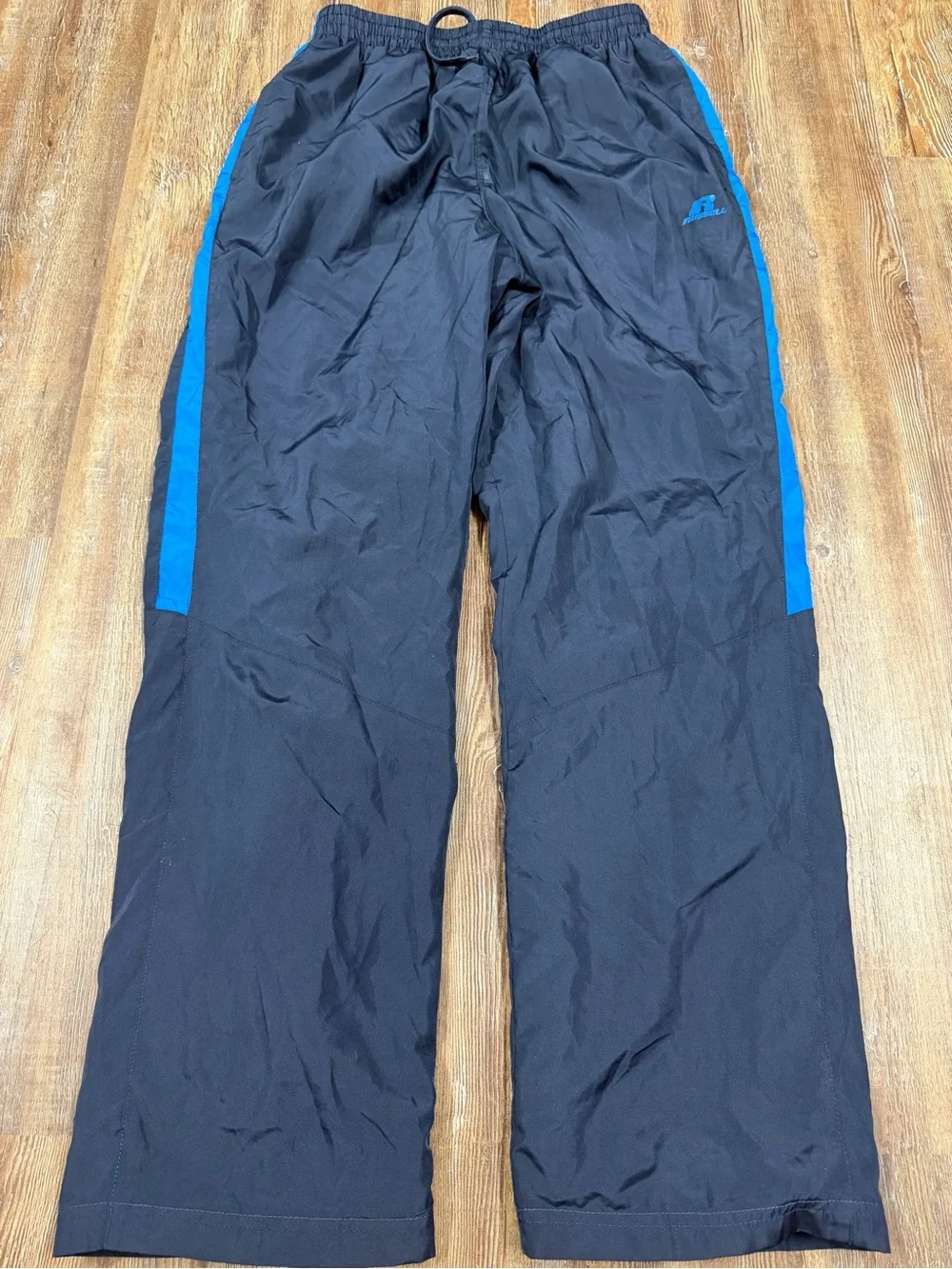 Vintage Russell Athletic navy blue track pants with blue side stripe, size M